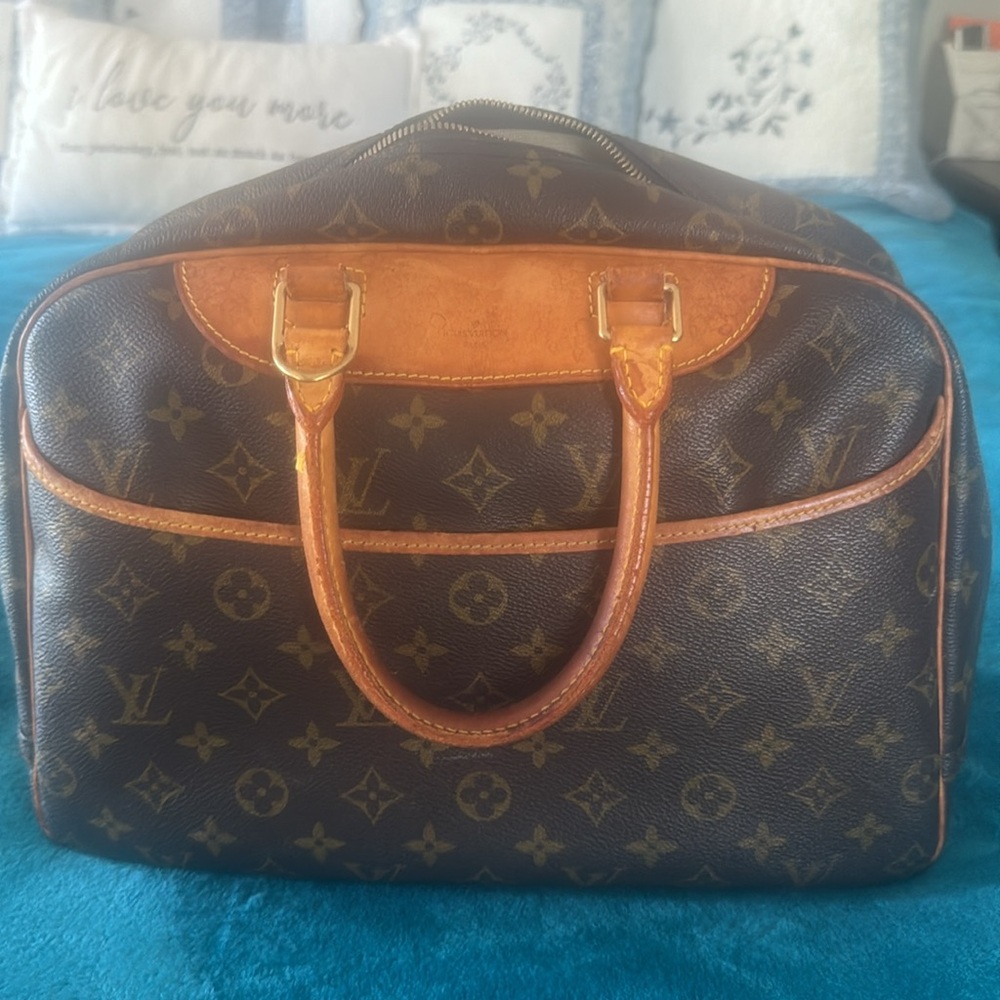 Louis Vuitton and LV wallet included.  There is 2 small marks on the inside